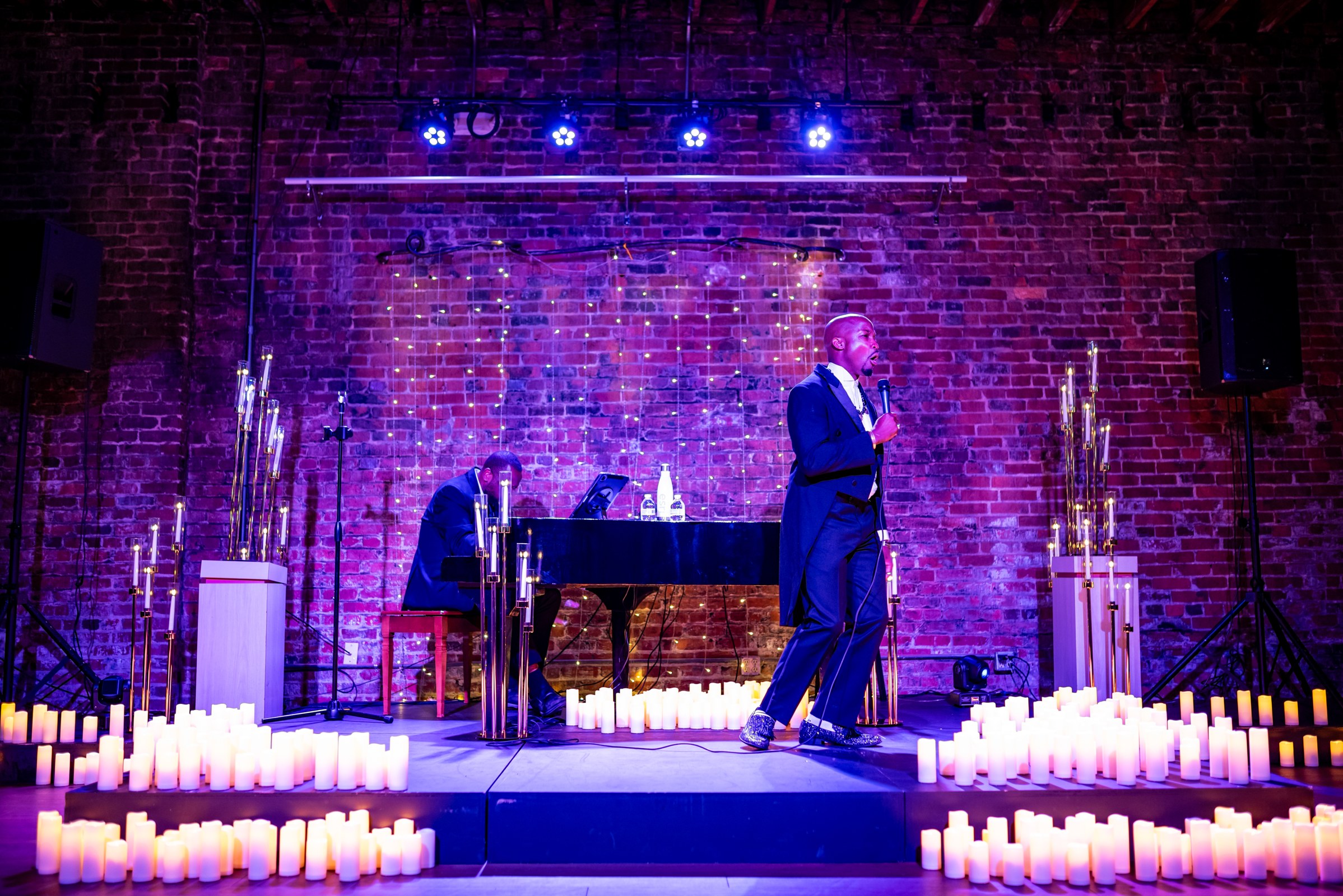 Elias Hendricks performing Classical Soul in a candlelit room